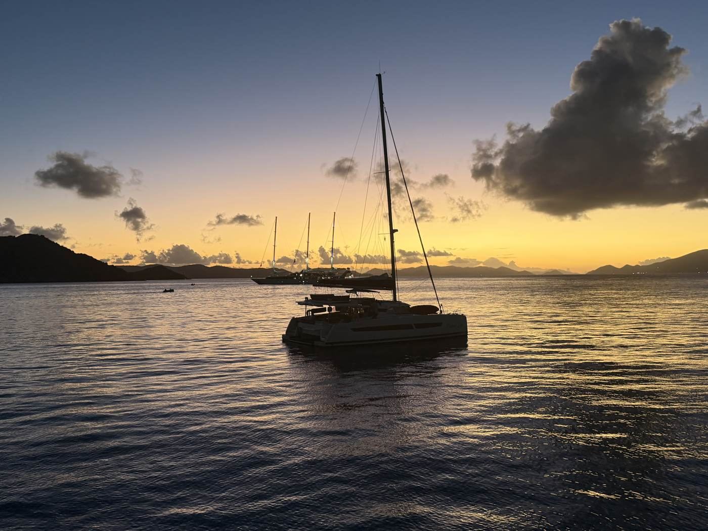 Ne Plus Ultra silhouetted against a Caribbean sunset in the British Virgin Islands