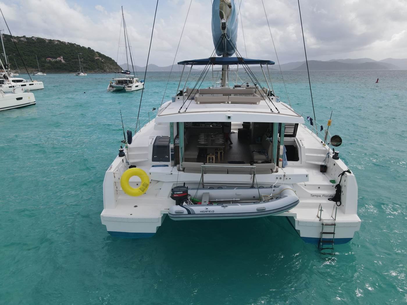Ne Plus Ultra with her fold-down garage door transom open, merging salon and cockpit, anchored at Jost Van Dyke
